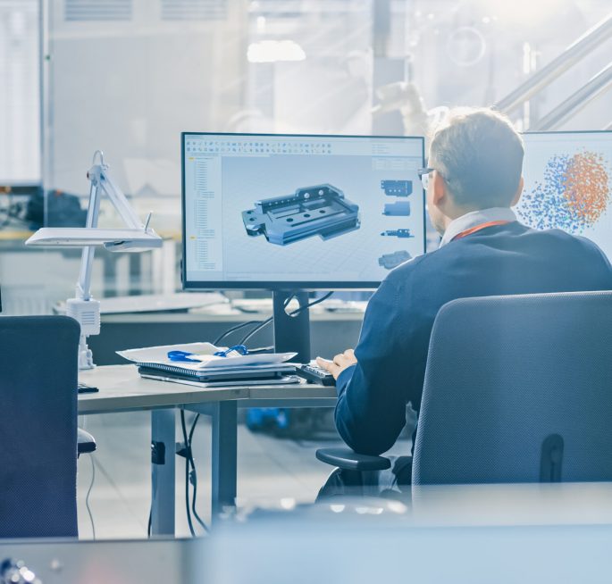 Back,View,Of,Industrial,Engineer,Working,On,Desktop,Computer,In Back,View,Of,Industrial,Engineer,Working,On,Desktop,Computer,In